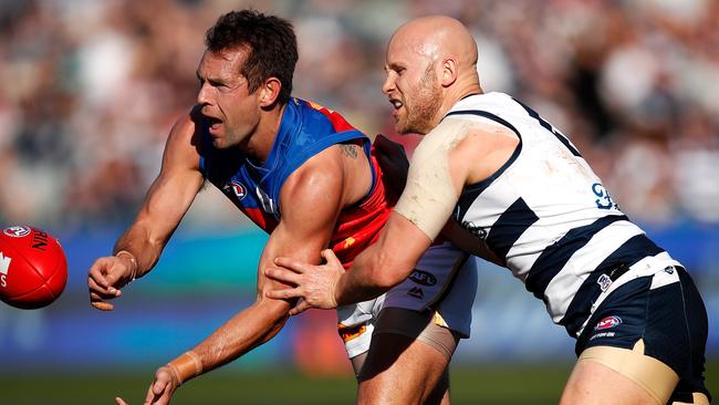 Luke Hodge and Gary Ablett cross paths in a Geelong-Brisbane clash last year. Picture: Getty Images