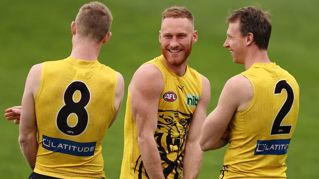 Nick Vlastuin was in good spirits with Jack Riewoldt and Dylan Grimes. Picture: Michael Klein