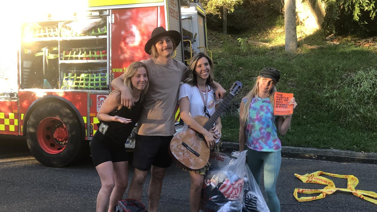 Householders Lauren Coulter (left), Joshua ‘Reggie’ Songailar, Elise Coulter and their friend Ella Dixon, with their remaining belongings outside the Riverview Rd, Avalon home they rented that was destroyed by fire. Picture: Supplied