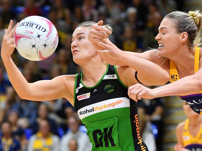 Courtney Bruce of the Fever (left) controls the ball as Caitlin Bassett of the Lightning (right) defends during the Round 3 Super Netball match between the Sunshine Coast Lightning and the West Coast Fever at the University of the Sunshine Coast Sports Stadium in Sippy Downs, Queensland, Saturday, May 12, 2018. (AAP Image/Darren England) NO ARCHIVING, EDITORIAL USE ONLY