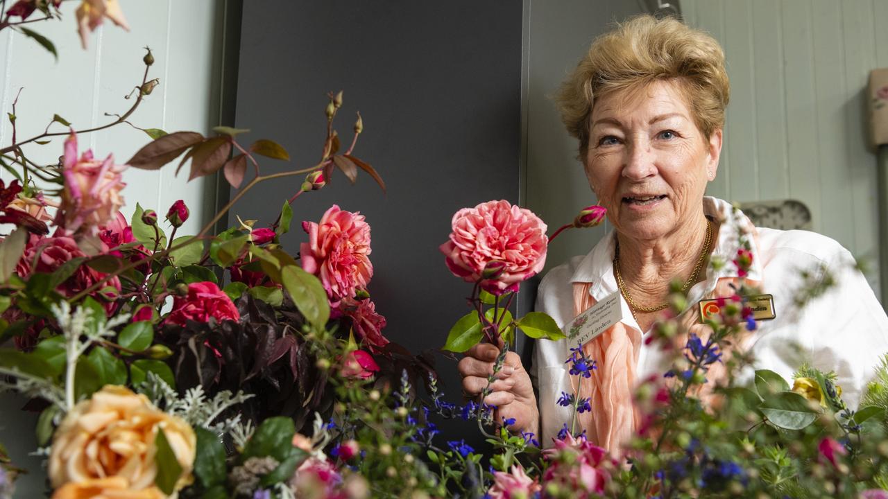 Heritage Roses in Australia member Bev Linden with heritage roses on show in the 2022 Spring Champion Rose Show at the Rose Cottage in the Queensland State Rose Garden, Saturday, October 8, 2022. Picture: Kevin Farmer