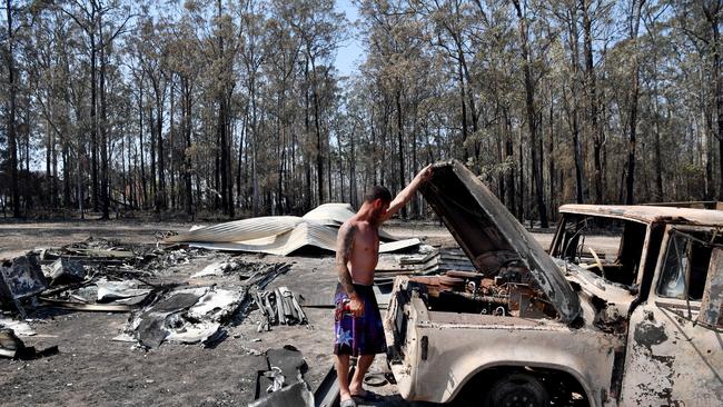 Danny Wearne surveys the bushfire damage to his property in Rainbow Flat. Picture: Getty