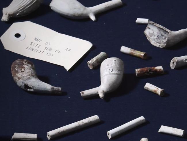 Clay pipes and other artefacts found during excavation.