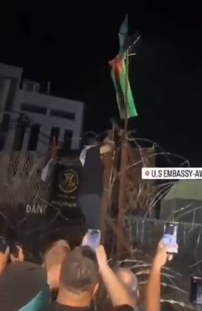 Protesters access part of the US Embassy in Beirut and raise the Palestinian flag.