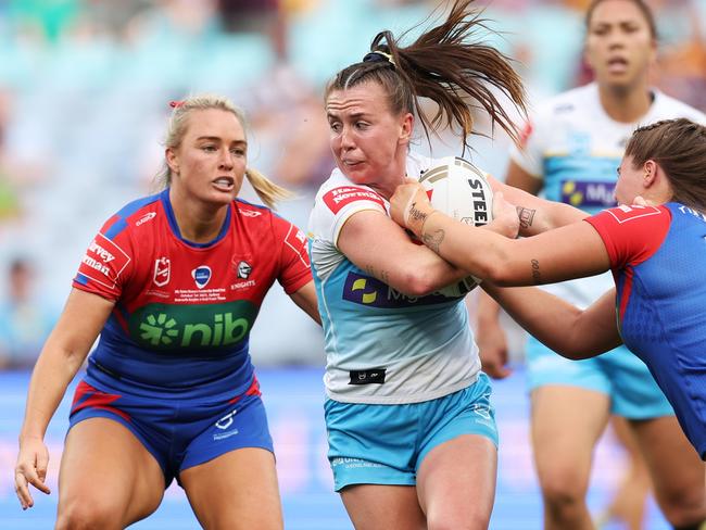 SYDNEY, AUSTRALIA – OCTOBER 01: Georgia Hale of the Titans is tackled during the 2023 NRLW Grand Final match between Newcastle Knights and Gold Coast Titans at Accor Stadium, on October 01, 2023, in Sydney, Australia. (Photo by Matt King/Getty Images)