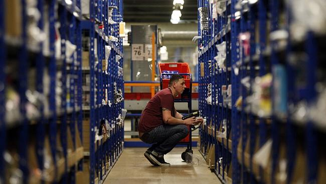  In this 01/12/2008 file photo, an Amazon.com team member loads boxes of fulfilled orders into a truck at their Fernley, Neva...