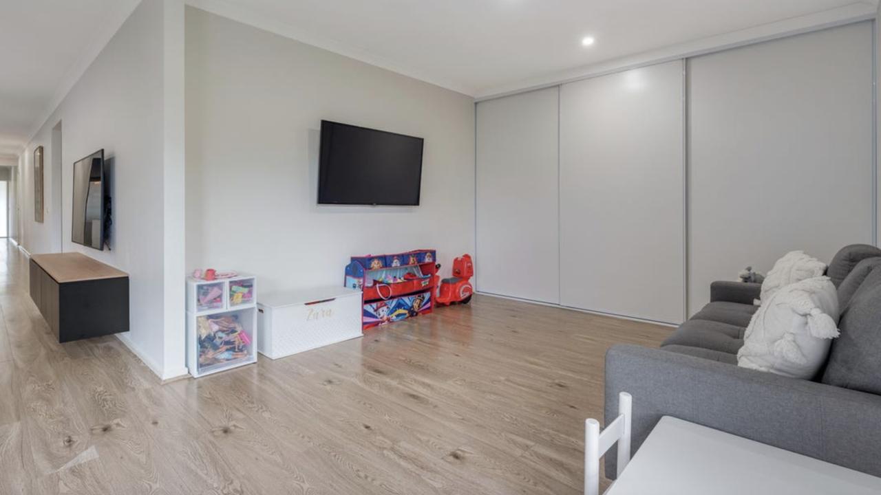 A separate rumpus room offers kids or teens their own retreat one of the home’s most versatile and family-friendly features.