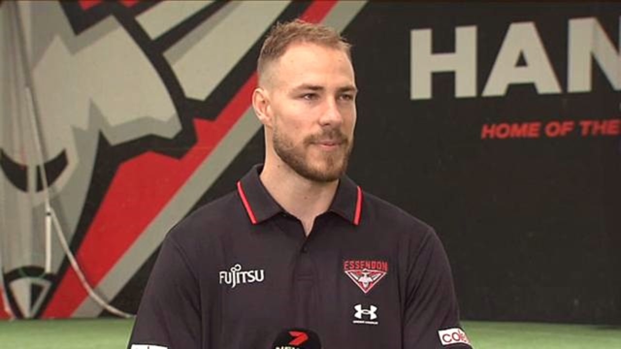 Ben McKay in red and black. Photo: Twitter, @7NewsMelbourne.