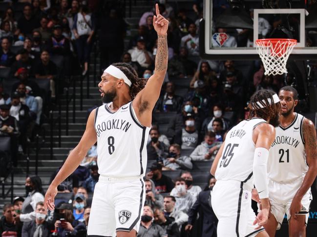 BROOKLYN, NY - OCTOBER 8: Patty Mills #8 of the Brooklyn Nets celebrates during a preseason game against the Milwaukee Bucks on October 8, 2021 at Barclays Center in Brooklyn, New York. NOTE TO USER: User expressly acknowledges and agrees that, by downloading and or using this Photograph, user is consenting to the terms and conditions of the Getty Images License Agreement. Mandatory Copyright Notice: Copyright 2021 NBAE (Photo by Nathaniel S. Butler/NBAE via Getty Images)