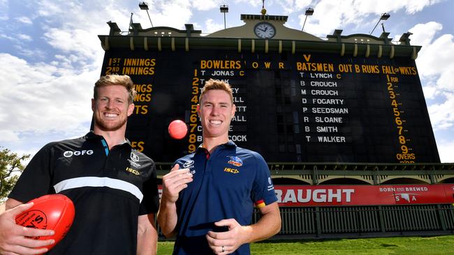 Footballers Tom Jonas from Port Adelaide Football Club and Tom Lynch from the Adelaide Crows who will both captain their respective sides in the Bushfire appeal T20 cricket game which will at Adelaide Oval. (AAP Image/Sam Wundke)