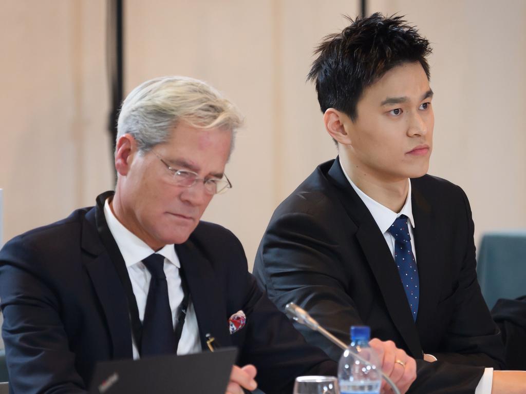 Sun Yang looks on next to his counsel Ian Meaking prior to his public hearing before the Court of Arbitration for Sport. (Photo by jean-guy PYTHON / AFP)