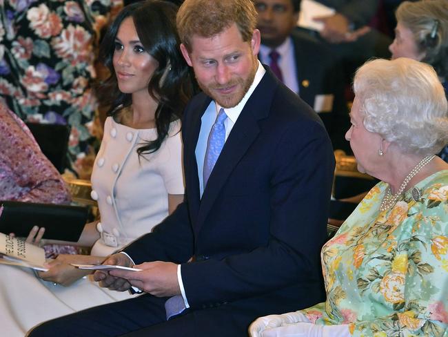 The Queen chats with Harry and Meghan at Buckingham Palace. Picture: AP