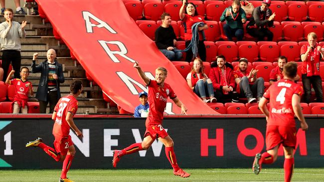 Ben Halloran celebrates with his teammates. Picture: James Elsby/Getty