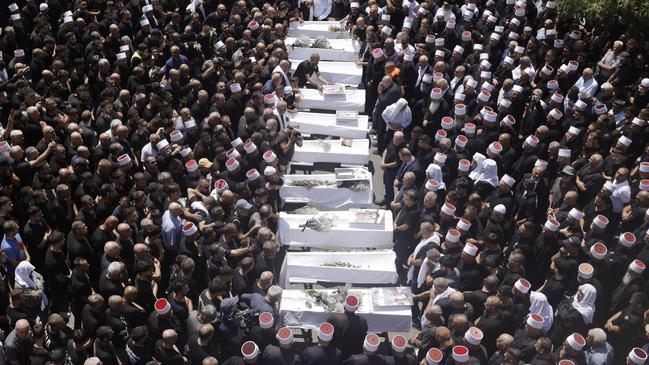 Mourners attend a funeral on July 28 for the 10 of the victims of a rocket attack in Majdal Shams, Golan Heights. Picture: Amir Levy/Getty Images