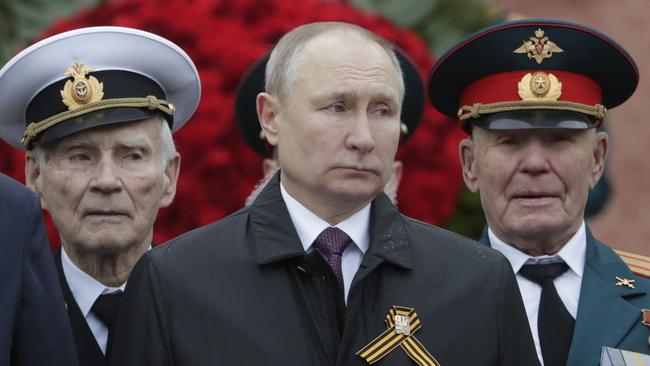 Russian President Vladimir Putin attends a flower-laying ceremony at the Tomb of the Unknown Soldier after the Victory Day military parade in Moscow. Picture: AFP