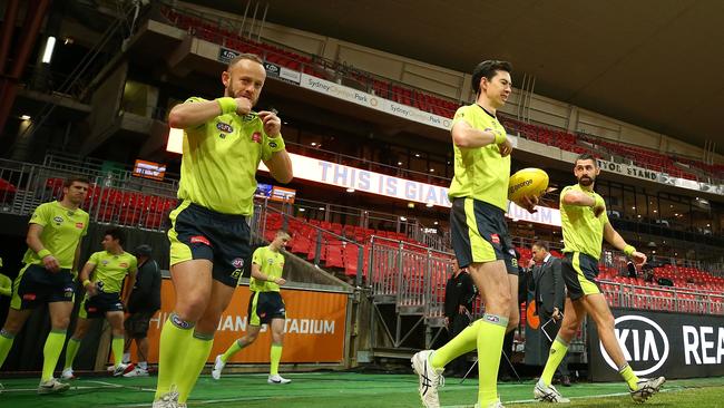 Umpires are believed to be so frightened of backlash from angry gamblers, they’ve been checking stats on their phones in contravention of AFL rules. Picture: AAP Image/Mark Nolan