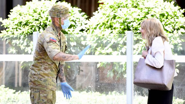 A soldier blocks a pedestrian at Peppers Waymouth Street Hotel in the CBD where the Parafield cluster originated. Picture: NCA NewsWire / Naomi Jellicoe