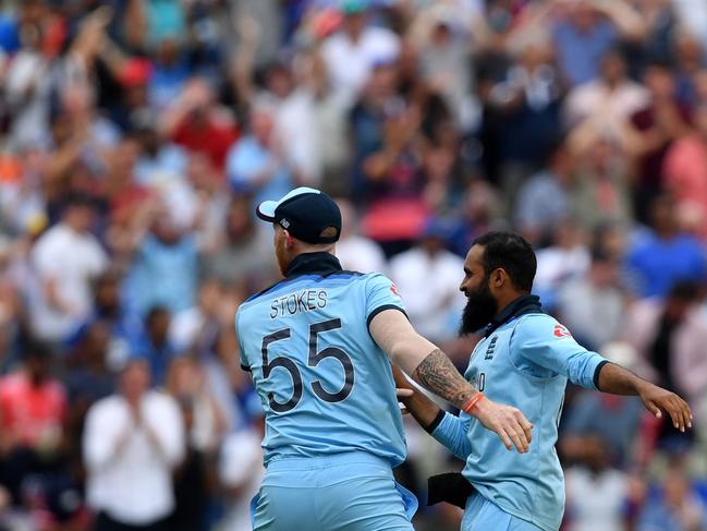 England's Adil Rashid (right) celebrates with England's Ben Stokes the wicket of Australia's Alex Carey for 46.