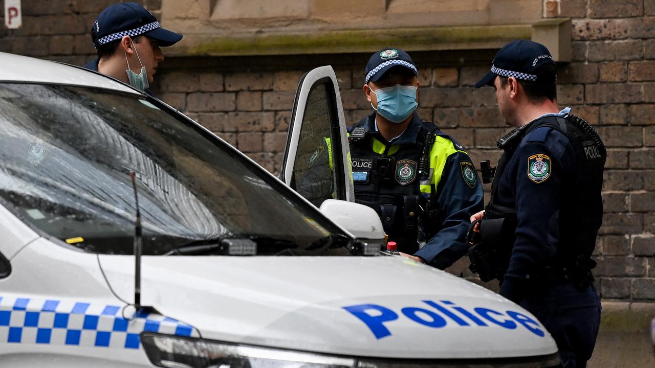 NSW Police officers wear face masks while walking through Sydney's CBD on Saturday.  Picture: NCA NewsWire/Bianca De Marchi