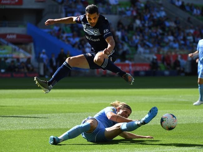 Harrison Delbridge of City (bottom) and Andrew Nabbout of Victory contest during the Round 11 A-League match between the Melbourne City FC and the Melbourne Victory at AAMI Park in Melbourne, Saturday, December 21, 2019. (AAP Image/Julian Smith) NO ARCHIVING, EDITORIAL USE ONLY