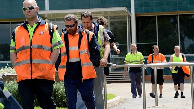 Holden workers leave the factory in Elizabeth.