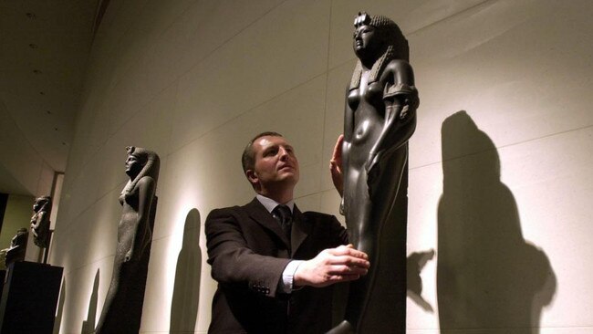 With a black basalt statue of Cleopatra at the 2001 exhibition From History to Myth. Picture: Alamy/The Times