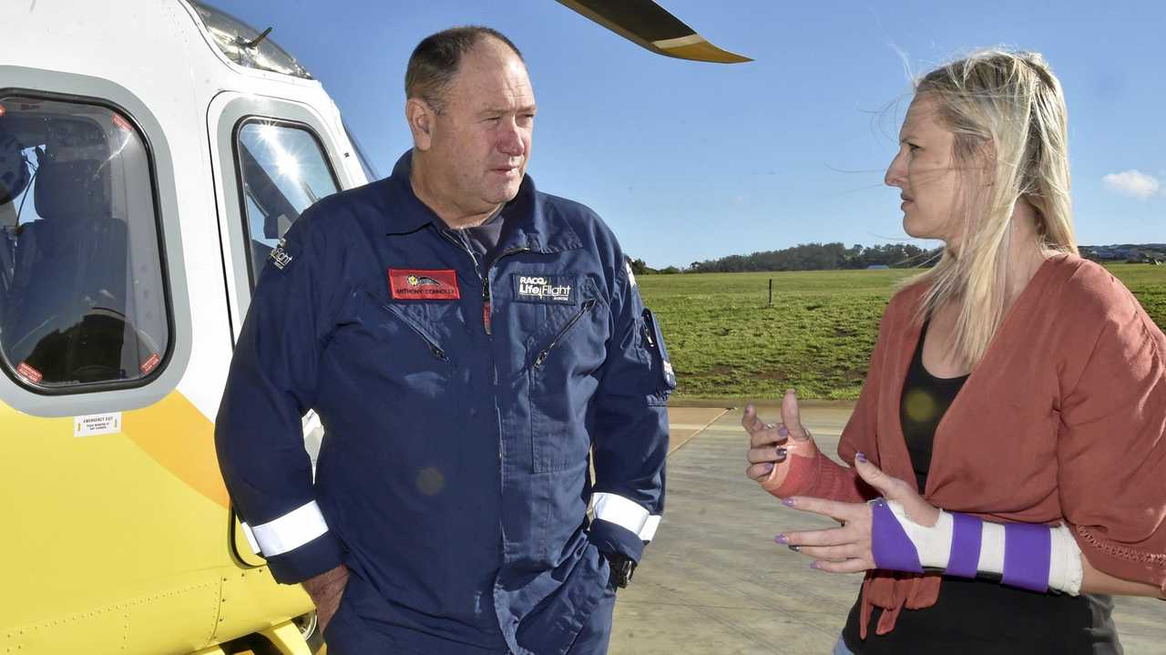 Tiffany Thompson was airlifted after a motorbike crash and was at the LifeFlight base to meet members of the crew, including Anthony Connolly.  LifeFlight. April 2019. Picture: Bev Lacey