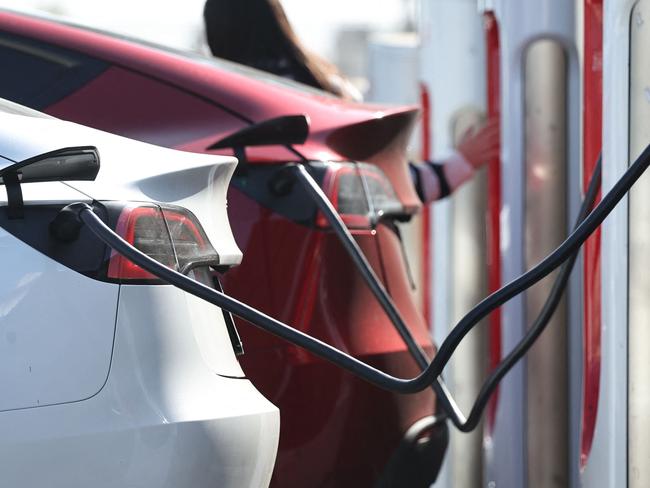 PASADENA, CALIFORNIA - SEPTEMBER 23: Tesla electric vehicles (EVs) recharge at a Tesla Supercharger station on September 23, 2024 in Pasadena, California. The California Air Resources Board announced that Californiaâs carbon dioxide emissions dropped 2.4 percent in 2022, even as the economy rebounded from the COVID-19 pandemic, primarily due to electric vehicle use and cleaner fuels.   Mario Tama/Getty Images/AFP (Photo by MARIO TAMA / GETTY IMAGES NORTH AMERICA / Getty Images via AFP)