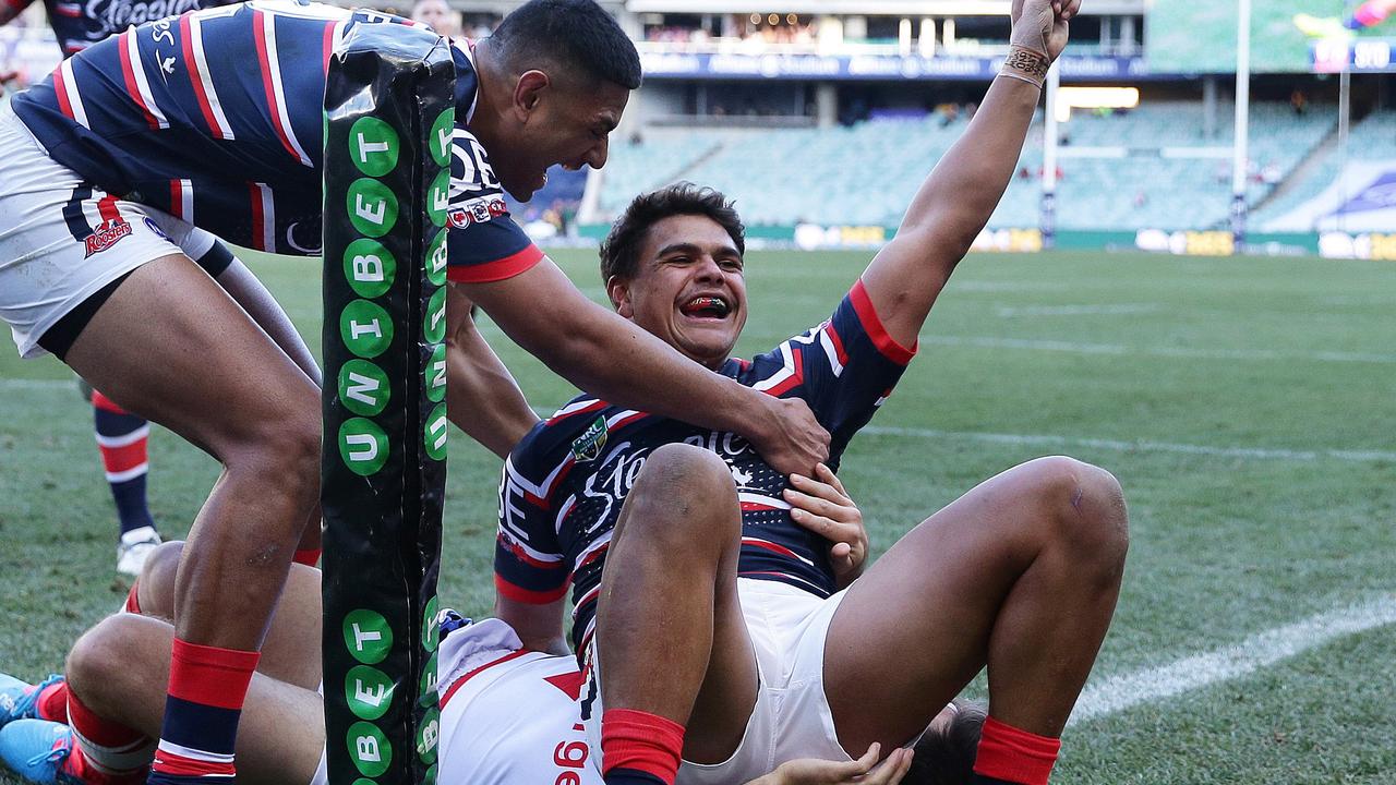 Roosters young gun Latrell Mitchell celebrates after scoring a try.