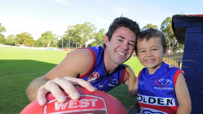 Jack with his dad during his Central District days. Picture: Ian Roddie