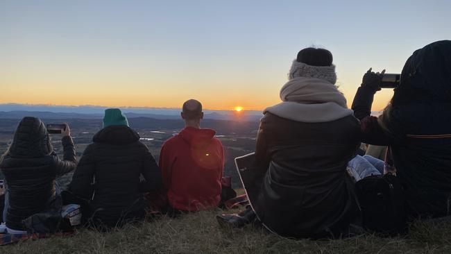 Pack a picnic, a camera and rug up to watch the sunset over the Canungra Valley. Picture: Callum Dick.