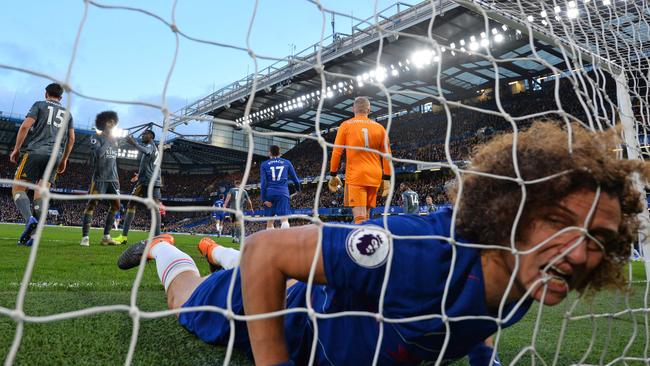 TOPSHOT - Chelsea's Brazilian defender David Luiz reacts as he finds himself in the Leicester goal after missing a good chance during the English Premier League football match between Chelsea and Leicester City at Stamford Bridge in London on December 22, 2018. (Photo by Ben STANSALL / AFP) / RESTRICTED TO EDITORIAL USE. No use with unauthorised audio, video, data, fixture lists, club/league logos or 'live' services. Online in-match use limited to 120 images. An additional 40 images may be used in extra time. No video emulation. Social media in-match use limited to 120 images. An additional 40 images may be used in extra time. No use in betting publications, games or single club/league/player publications. /