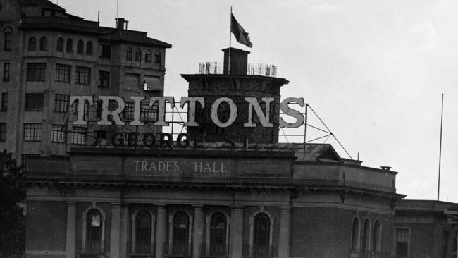 The Trittons Furniture Store sign on top of the Brisbane Trades Hall Building.