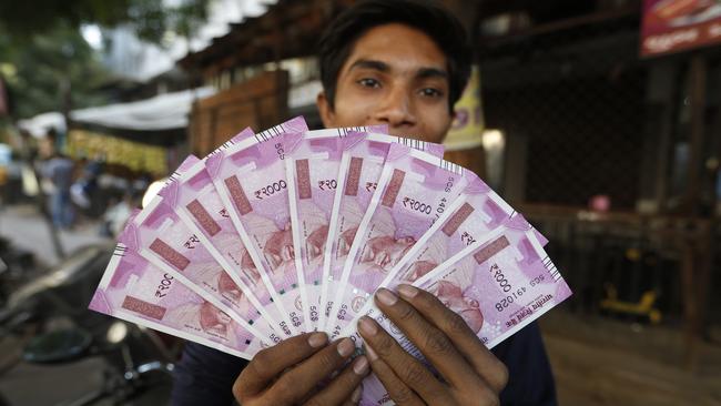 The sudden withdrawal of 85 per cent of India’s currency has left cash in short supply, retail sales stumbling and wholesale markets in turmoil. Picture: Ajit Solanki/AP