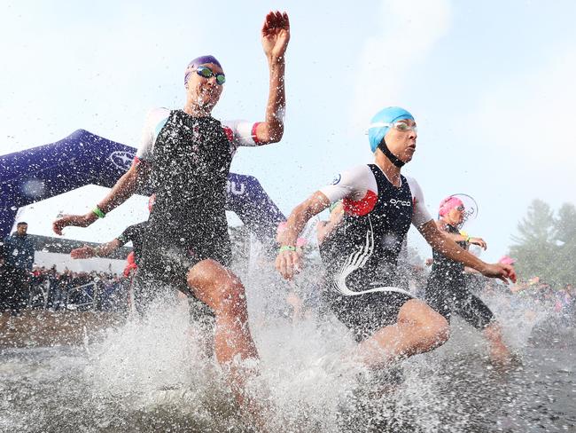 Lauren Brandon (L) and Liz Blatchford start the swim at Ironman Mont-Tremblant.