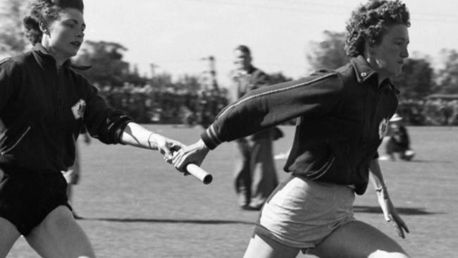 Marlene Matthews and Norma Croker practise their baton changing leading up to the 1956 Melbourne Olympic Games.