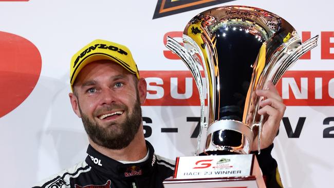 Shane van Gisbergen celebrates winning Race 23 at SydneySuperNight.