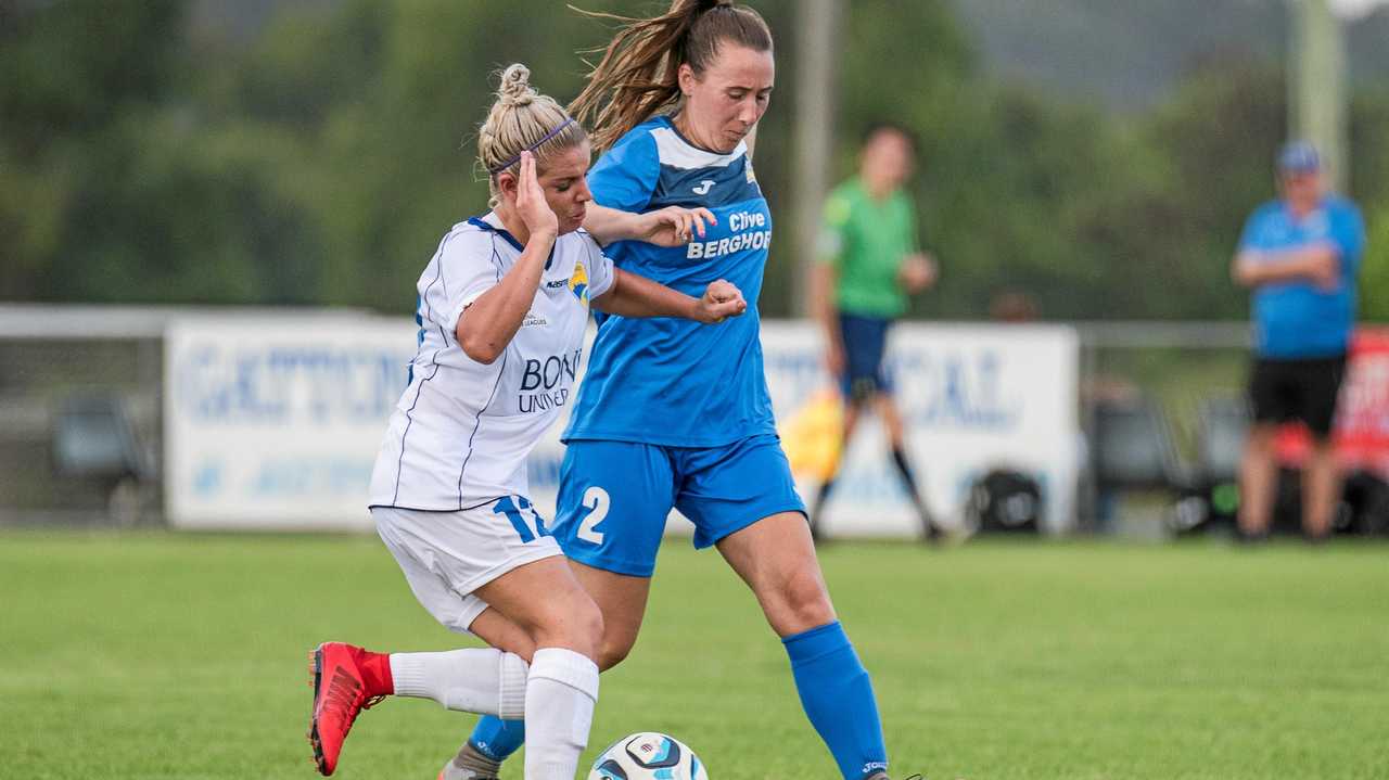 UNDER PRESSURE: South West Queensland Thunder midfielder Lana Styler (right) takes on the Gold Coast United defence. Picture: DSL Photography