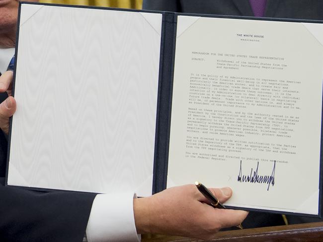 US President Donald Trump holds up an executive order withdrawing the US from the Trans-Pacific Partnership. Picture: AFP/SAUL LOEB
