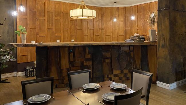 The wooden panelling, tables, and details were handmade by Jack and Frank.