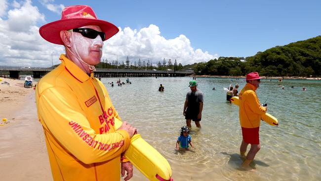 Lifesavers Clive Newman and Wayne Weideman at Tallebudgera Creek. Picture:  AAP/David Clark