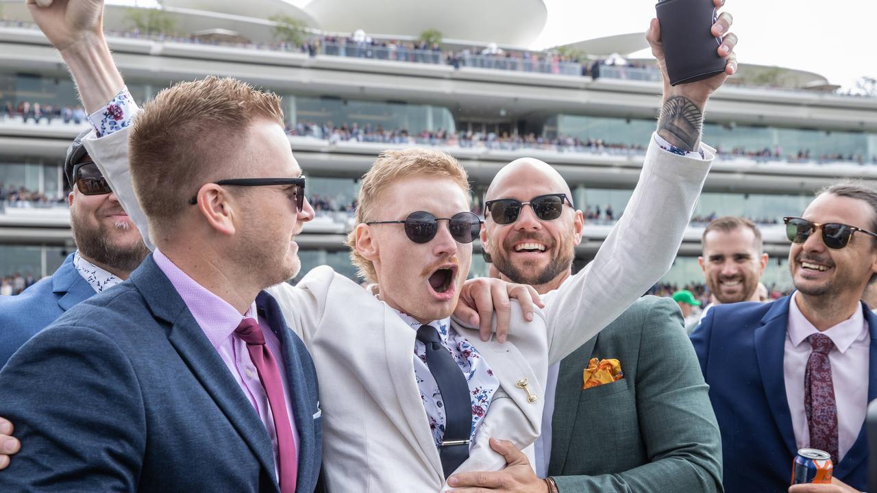 WINNER WINNER: A group of lucky punters celebrate after a race. Picture: Jason Edwards