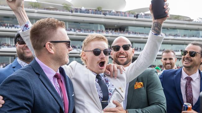 WINNER WINNER: A group of lucky punters celebrate after a race. Picture: Jason Edwards