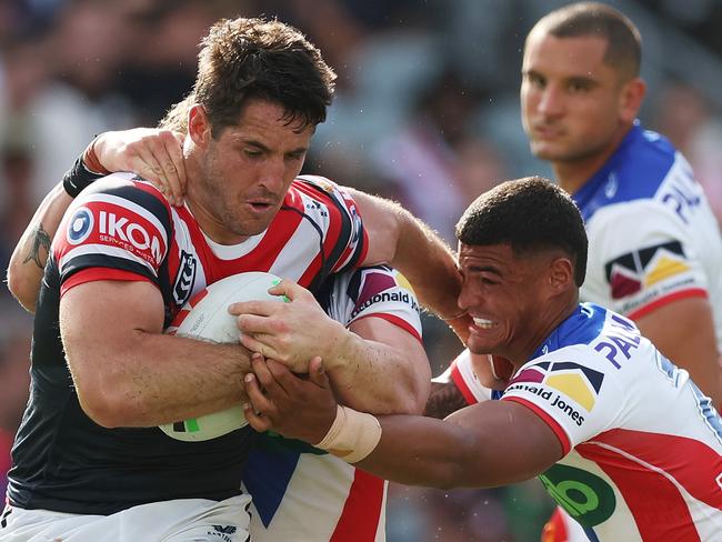 GOSFORD, AUSTRALIA - FEBRUARY 23: Nat Butcher of the Roosters is tackled during the 2025 NRL Pre-Season Challenge match between Sydney Roosters and Newcastle Knights at Industree Group Stadium on February 23, 2025 in Gosford, Australia. (Photo by Mark Metcalfe/Getty Images)