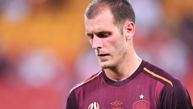 Roar defender Luke DeVere feels the pain. (AAP Image/Albert Perez)