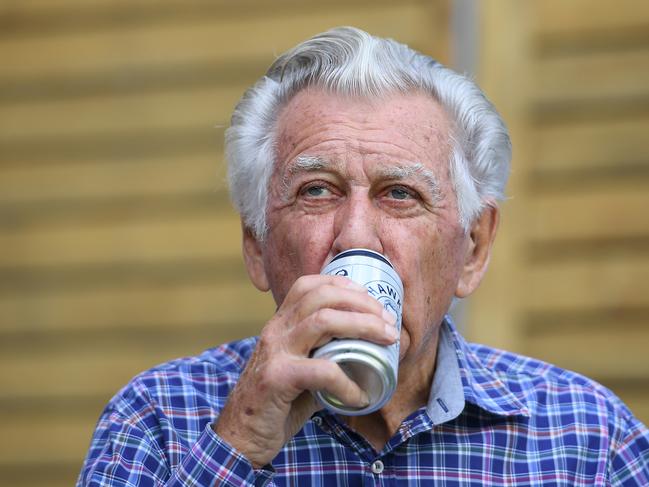 Former prime minister Bob Hawke drinks a beer at a media event to celebrate his 88th birthday, in Sydney, Thursday, December 7, 2017. Mr Hawke was presented with a wax sculpture of himself holding a can Hawkes Brewing Co. beer. (AAP Image/Dan Himbrechts)