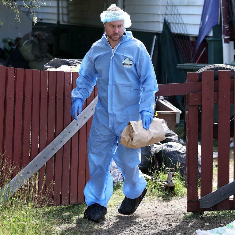 Evidence is removed from the Gin Gin home where Pheobe Bishop was living before her disappearance. Picture: Adam Head