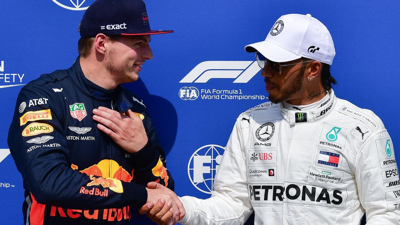 Hamilton shakes hands with Verstappen after qualifying for the German Grand Prix.