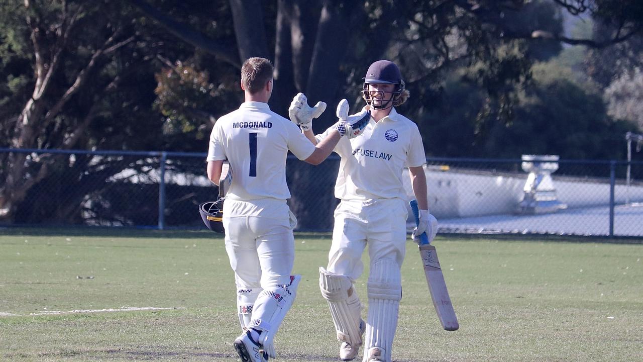 Josh McDonald and Lachie Field come together after McDonald's 100 against Fitzroy Doncaster. Picture: Carey Neate