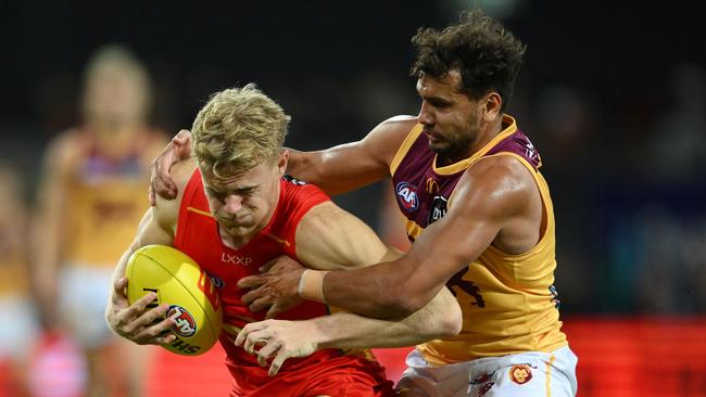 GOLD COAST, AUSTRALIA – JULY 27: Bodhi Uwland of the Suns competes for the ball against Callum Ah Chee of the Lions during the round 20 AFL match between Gold Coast Suns and Brisbane Lions at People First Stadium, on July 27, 2024, in Gold Coast, Australia. (Photo by Matt Roberts/AFL Photos/via Getty Images)